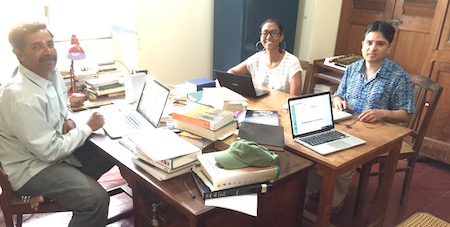 R. Sathyanarayanan, Mekhola Gomes and Nirajan Kafle study a Kadamba inscription.